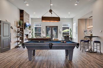 Community room with pool table, fireplace & lounge